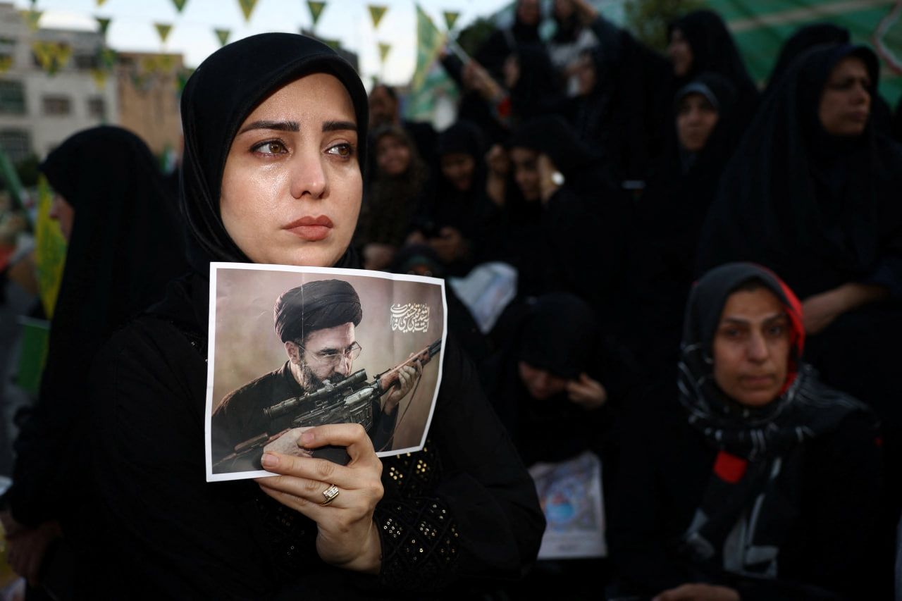 A woman holds a poster depicting Iran’s new Supreme Leader Mojtaba Khamenei, during a rally in Tehran, Iran, on April 29, 2026. 