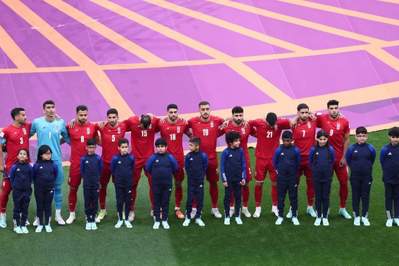 Iranian players line up during the national anthems before the match against England on November 21, 2022.