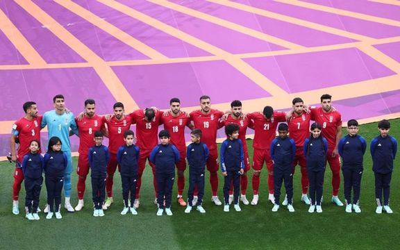 Iranian players line up during the national anthems before the match against England on November 21, 2022.