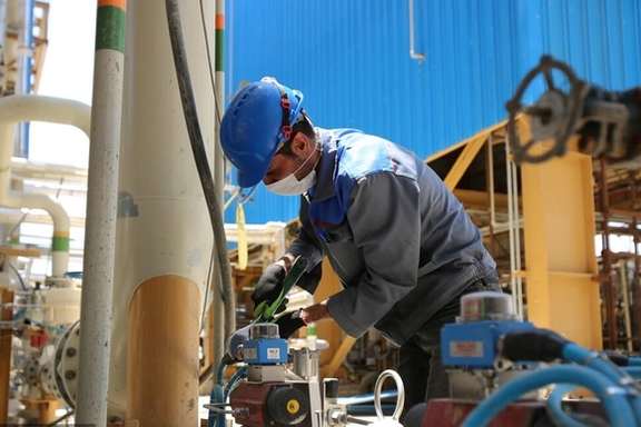 An Iranian worker at a refinery in southern Iran