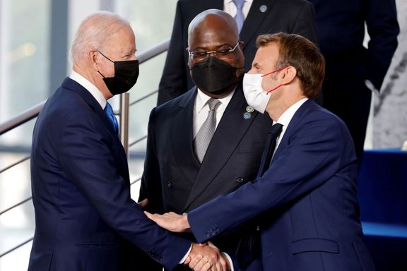 US President Joe Biden shakes hands with France's President Emmanuel Macron before the start of the G20 leaders' summit in Rome, October 30, 2021.