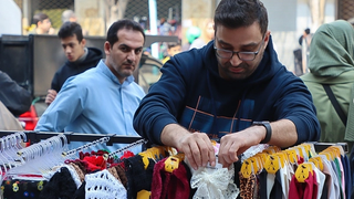 As war looms, Iran ensures military gets paid but people struggle