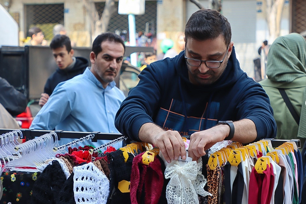 As war looms, Iran ensures military gets paid but people struggle