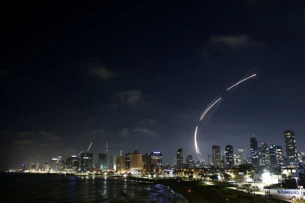 Iran unleashes hundreds of missiles on Israel, killing one