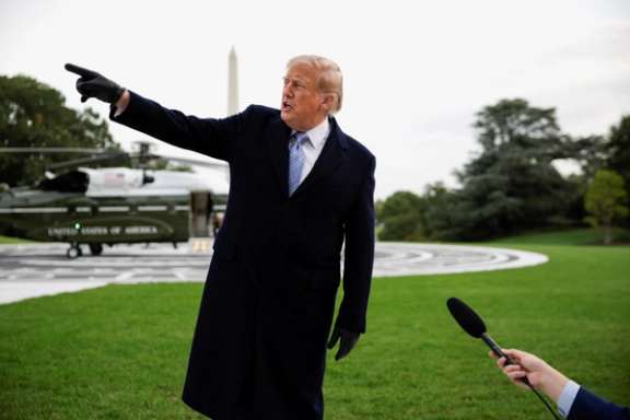 US President Donald Trump speaks to reporters in front of the Marine One