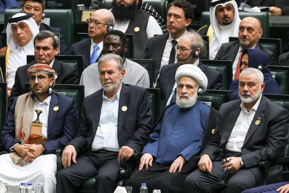 Palestinian Islamic Jihad chief Ziad al-Nakhala and Palestinian group Hamas' top leader Ismail Haniyeh attend Iran's new President Masoud Pezeshkian's swearing-in ceremony at the parliament in Tehran, Iran, July 30, 2024. 