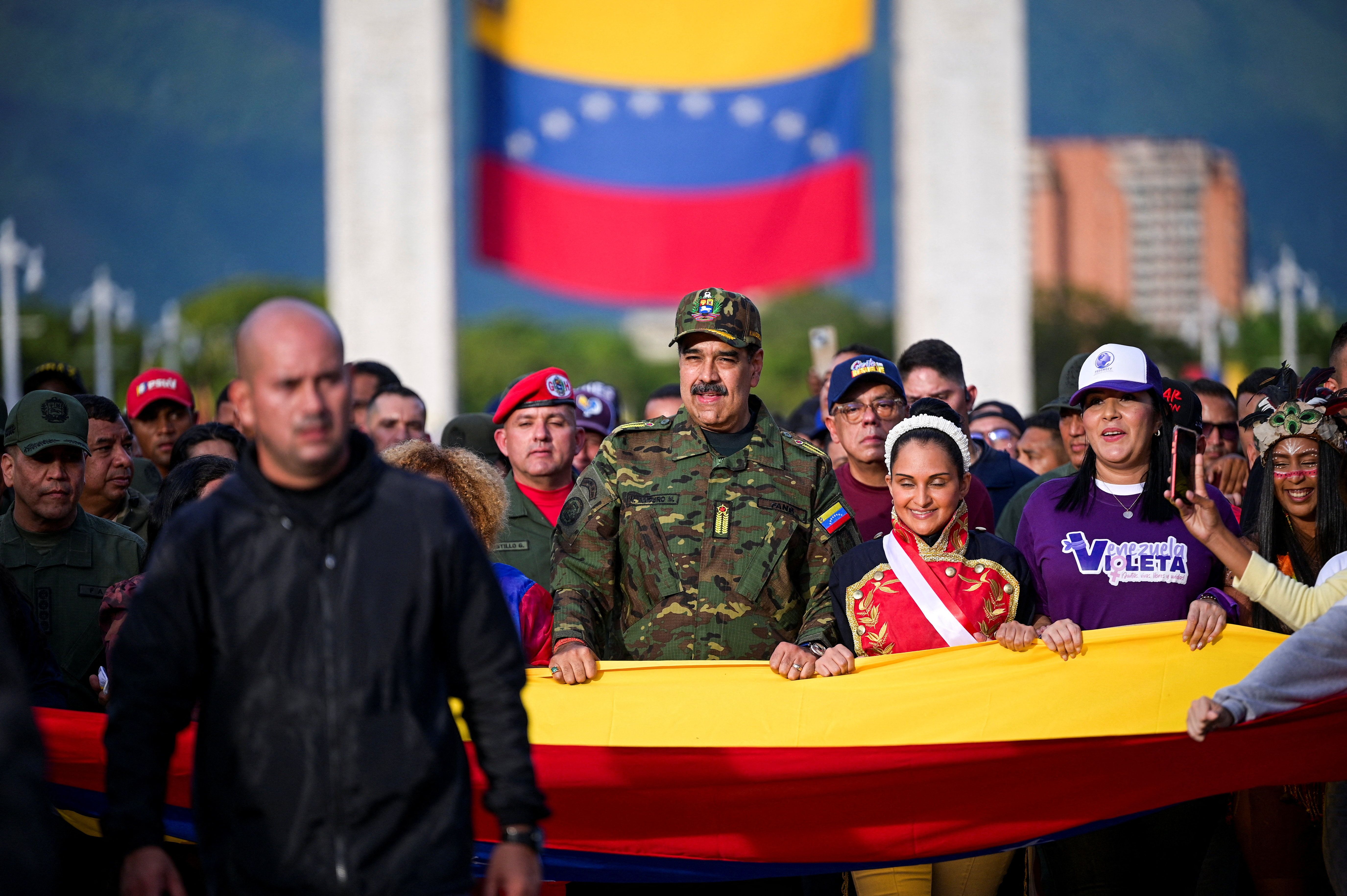 Venezuela's President Nicolas Maduro marches in a rally against a possible escalation of US actions toward the country, in Caracas, Venezuela, November 25, 2025. 