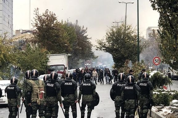 Riot police against protesters in Tehran during 2019 protests