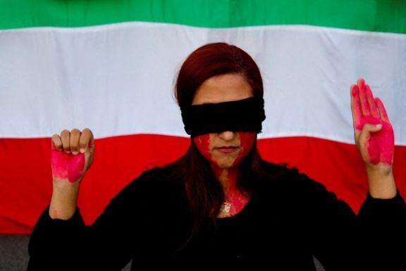 A woman attends a protest at Catalunya square in support of Iranian women and against the death of Mahsa Amini in Barcelona, Spain October 4, 2022.