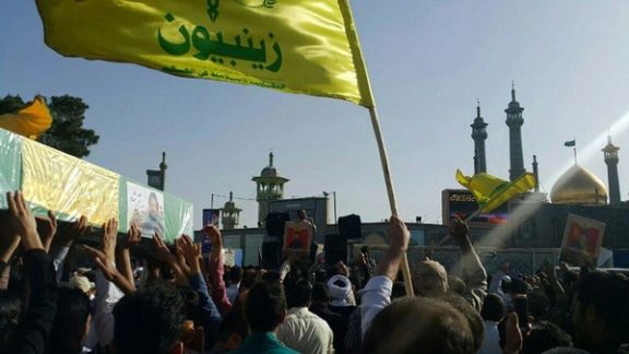 This photo shows a funeral procession of pro Iran militia members killed in Syria, and buried in Qom, Iran. The flag of Zainabiyoun Brigade, which is made up of Pakistani nationals, is in the foreground May 25, 2017.
