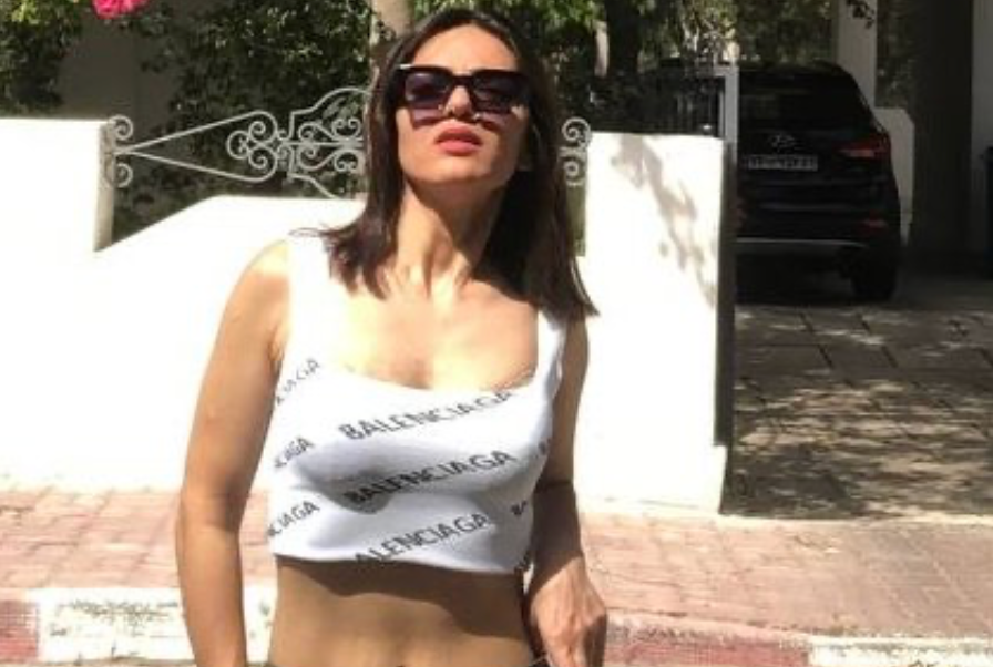 Woman who confronted harasser makes court appearance from prison