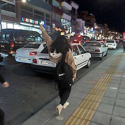 A girl who has unveiled in public in the city of Karaj, near capital Tehran