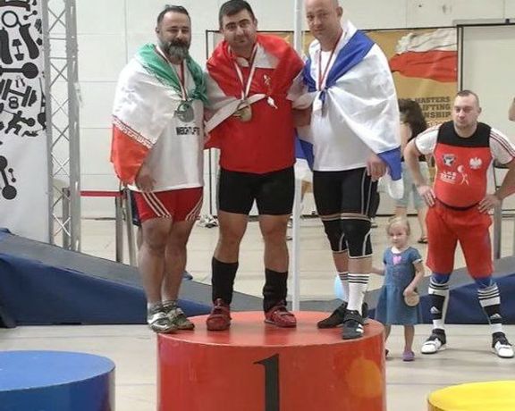Iranian Weightlifter Banned For Life Over Controversial Photo