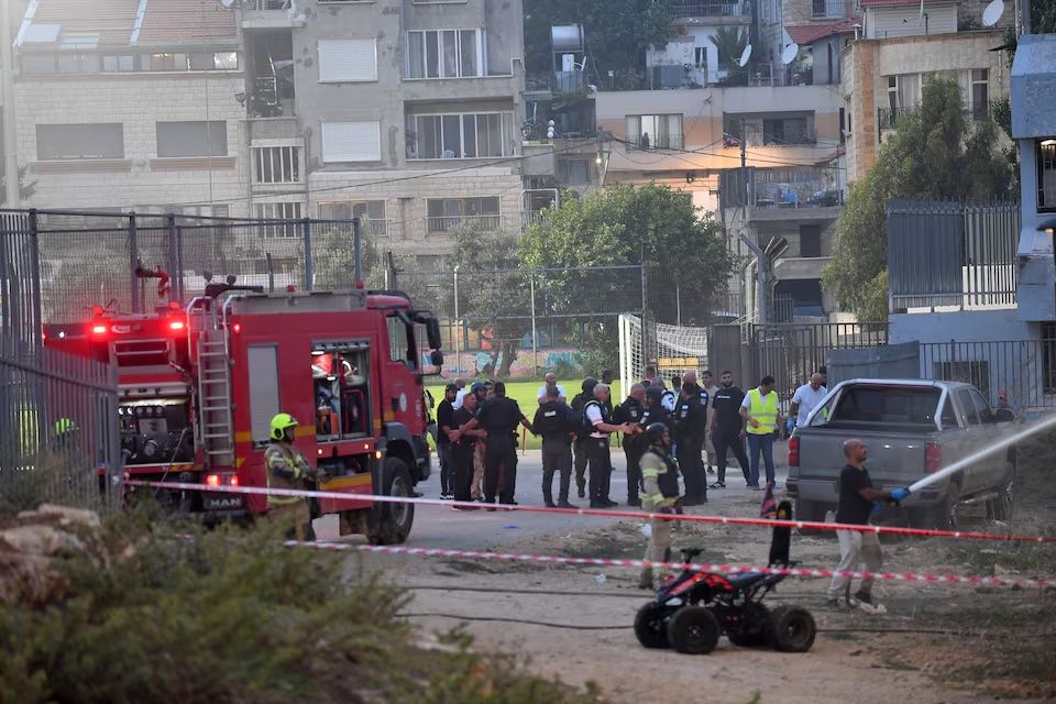 Israeli officials respond after rockets were launched across Lebanon’s border with Israel which, according to Israel’s ambulance services critically injured multiple people at a soccer pitch in Majdal Shams, a Druze village in the Israeli-occupied Golan Heights, July 27 2024.