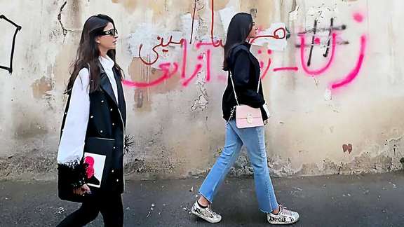 Two Iranian women defying hijab laws in public