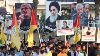 US Sanctions Iran-Backed Group, While Releasing Funds For Tehran