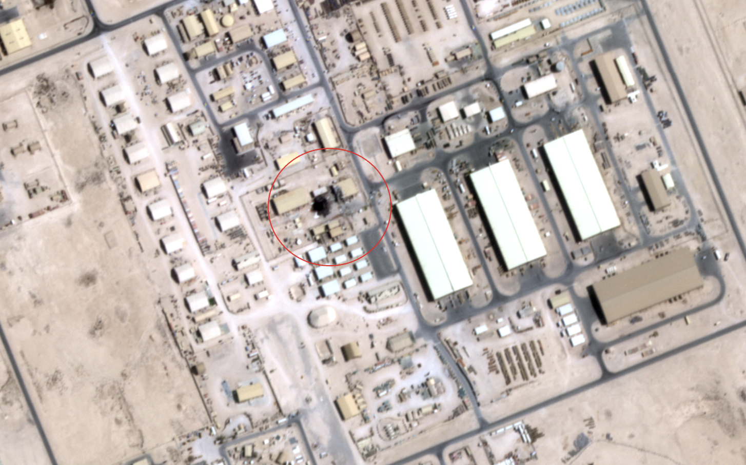 A satellite image taken on June 24 by US firm Satellogic obtained by Iran International appears to show possible damage to a sensitive communication site within the US airbase at Al Udeid, Qatar which was attacked by Iran on June 23, with red circle added to identify the area of interest. 