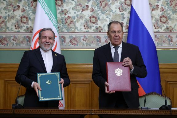 Russian Foreign Minister Sergei Lavrov and Iranian Foreign Minister Abbas Araghchi pose for a picture during a document signing ceremony following their talks in Moscow, Russia, December 17, 2025.