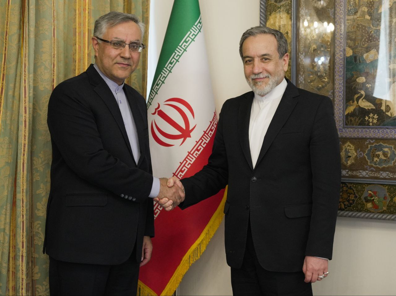 Iran's ambassador to London Ali Mousavi (left) and Iran's foreign minister Abbas Araghchi