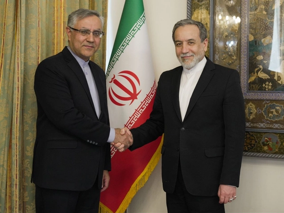 Iran's ambassador to London Ali Mousavi (left) and Iran's foreign minister Abbas Araghchi