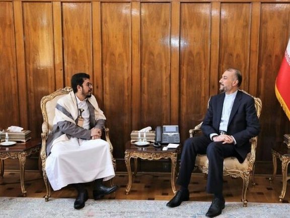Iran's foreign minister Hossein Amir-Abdollahian (L) with a Houthi envoy in April 2022