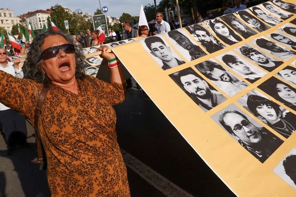 A woman holds a placard with pictures of, as Iranian call them, martyrs, during a rally of Iranian diaspora in Europe, on the eve of the first anniversary of the death of Mahsa Amini, which prompted protests across their country, in Brussels, Belgium September 15, 2023.