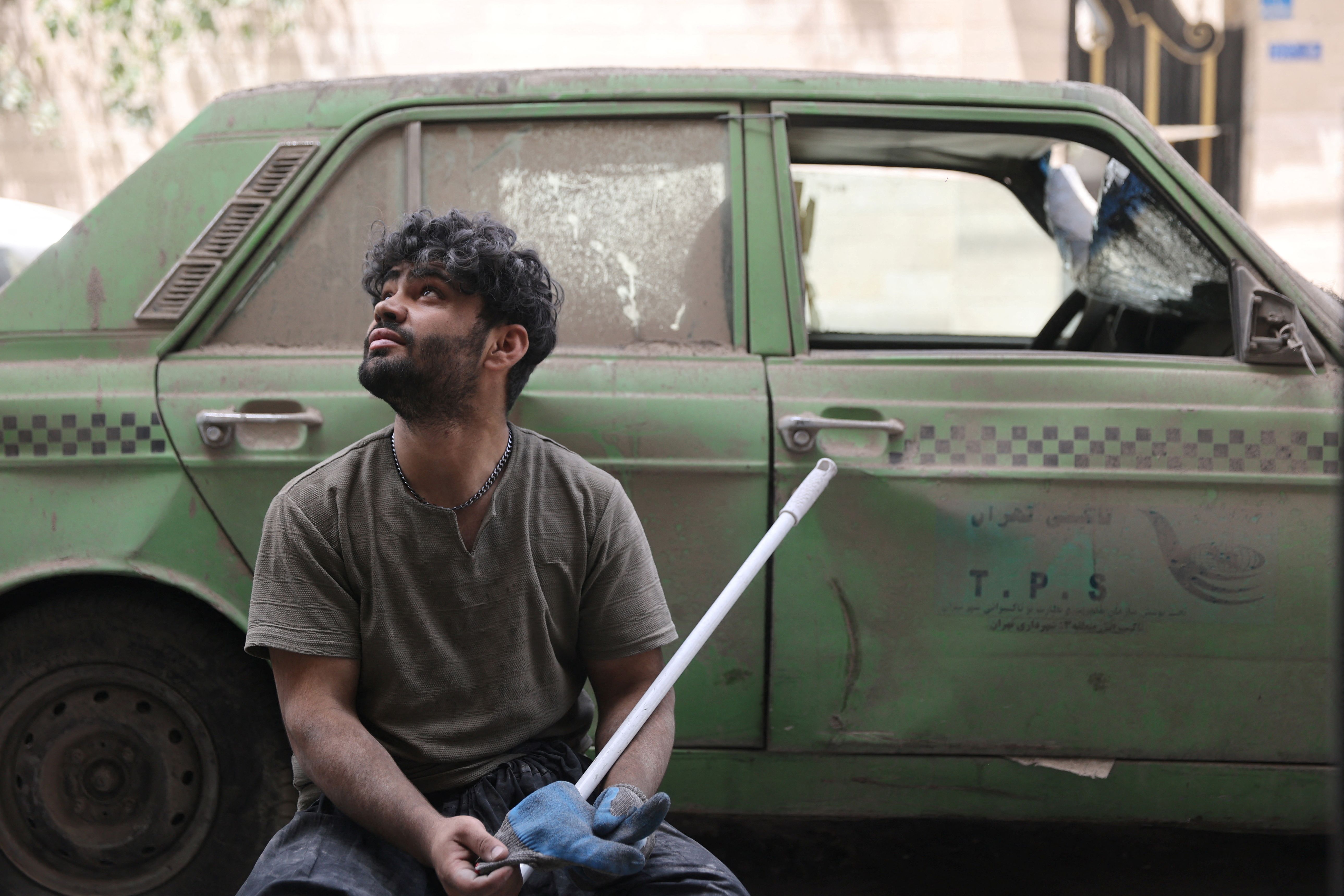 A man looks on as he works following an Israeli strike on a building on Monday, after the ceasefire between Israel and Iran, in Tehran, Iran, June 26, 2025. 