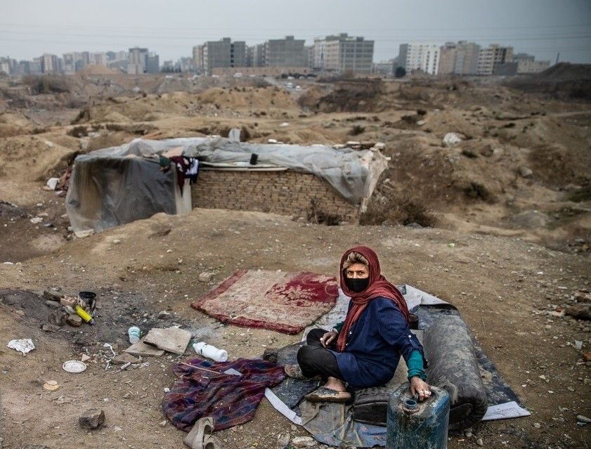 A poor woman living on the outskirts of Tehran without shelter (file photo) 
