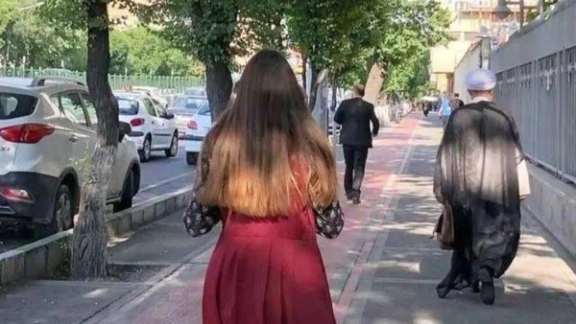 An Iranian woman without mandatory hijab in public