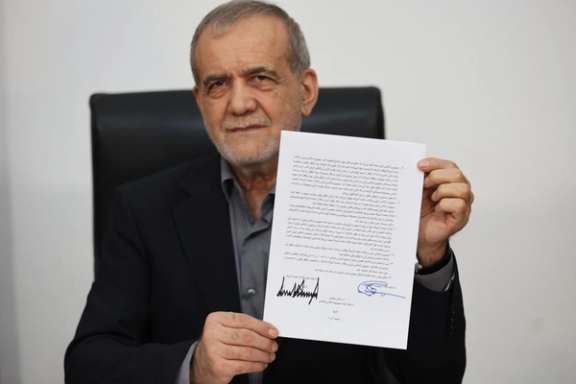 President Masoud Pezeshkian showing his copy of the MoU signed remotely with President Donald Trump. June 17, 2026