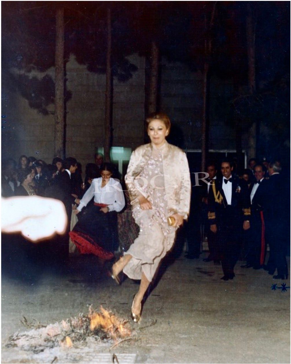 Iran's former queen, Farah Pahlavi, jumping over Chaharshanbeh Suri fire. Undated photo. 