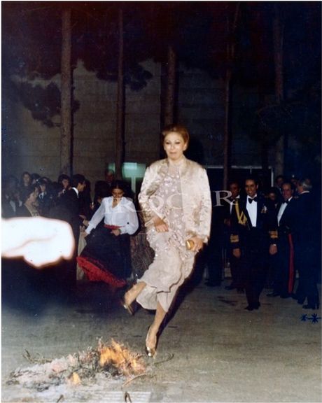 Iran's former queen, Farah Pahlavi, jumping over Chaharshanbeh Suri fire. Undated photo.