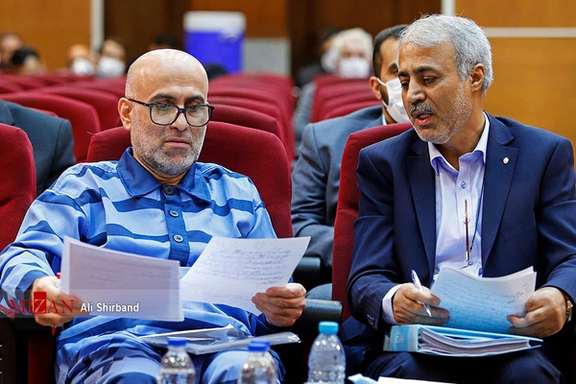 Former judiciary deputy Akbar Tabari (left)