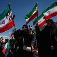 Iran officials celebrate ceasefire as critics warn it could stall change